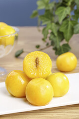 Fresh Xinjiang Apricots on White Plate - Healthy Organic Stone Fruit Display