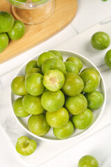 Fresh Green Sichuan Plums with Pit Removed in Bowl - Crisp Asian Stone Fruit