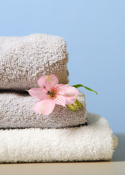 a stack of fresh towels on the table.. Vertical photo format