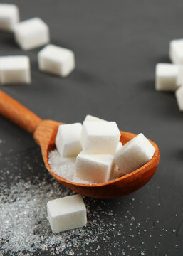 white sugar on the table on a light background close-up. Vertical photo format