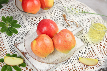 Fresh Red Fuji Apples from Xinjiang China on Glass Plate with Lace Tablecloth