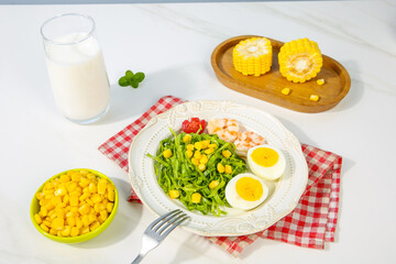Fresh Corn Salad with Eggs and Greens - Healthy Gourmet Meal with Milk and Corn Kernels