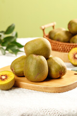 Fresh Red Heart Kiwi Fruits from Meishan Sichuan China on Wooden Board - Imported Exotic Tropical Fruit