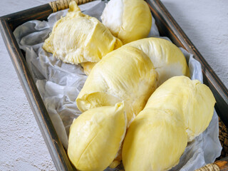 A yellow durian that has been peeled off to reveal the tasty yellow flesh of the durian. Durian...
