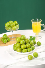 Fresh Sichuan Plums with Juice on Marble Surface - Healthy Organic Fruit Display
