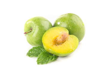 Fresh Green Plums with Yellow Flesh and Mint Leaves Isolated on White
