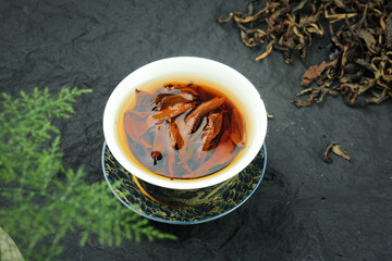 High Quality Organic Black Tea from Mountain Plantation - Traditional Chinese Longjing Tea Cup with Dried Leaves