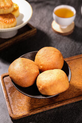 Traditional Golden Mooncakes with Tea for Mid-Autumn Festival Celebration