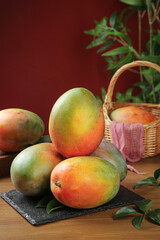 Fresh Ripe Mango Fruits on Slate Board with Wicker Basket - Tropical Food Photography