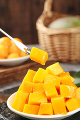 Fresh Diced Mango Cubes on Plate with Fork - Tropical Fruit Snack Ready to Eat