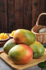 Fresh Ripe Mangoes on Wooden Board - Tropical Fruit Kitchen Still Life