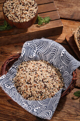 Organic Five-Color Rice and Brown Cereals Grains in Wooden Bowls on Rustic Wood Background