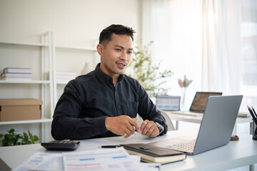 Male entrepreneur discussing project ideas via video call while working remotely.