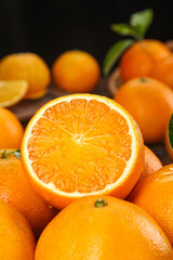 Fresh Picked Oranges with Cross Section Showing Juicy Citrus Fruit Interior