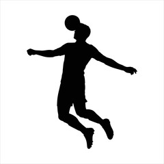Silhouette of a soccer player heading the ball