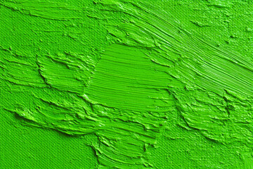 Fototapeta premium Vibrant green paint texture thick strokes on canvas artistic background