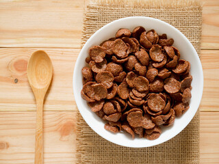 Chocolate breakfast cereal in a white bowl