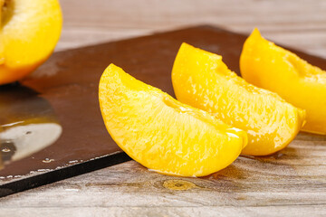 Fresh Golden Peach Slices on Wooden Cutting Board - Healthy Fruit Preparation