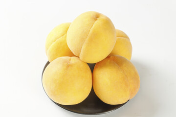 Fresh Yellow Peaches in Bowl on White Background - Healthy Summer Fruit