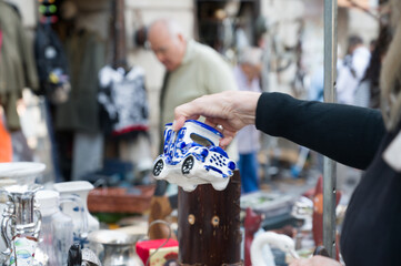A person looking for some deals in a flea market