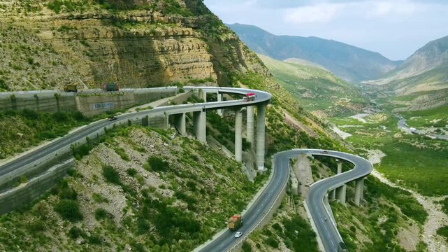 A panoramic view of a steel bridge constructed in the mountains