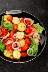 Panzanella salad tomato, croutons, onions vegetables dish natural product tasty snack fresh delicious gourmet food background on the table rustic top view copy space