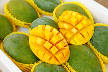 Fresh Sichuan Panzhihua Mangoes in Wooden Box Display - Tropical Fruit Market Presentation