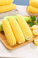 Fresh Yellow Corn on the Cob Bundle on Wooden Cutting Board - Healthy Organic Vegetable Food Photography