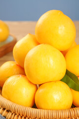 Fresh Golden Nectarines in Wicker Basket with Shallow Depth of Field