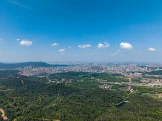 Wuhan cityscape panorama includes Jiangxia district with Qingshan mountain and clear blue sky background