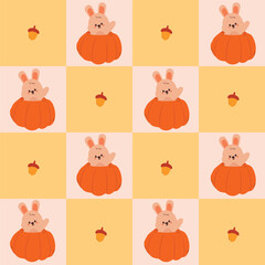 Obraz premium seamless pattern cute cartoon bunny inside autumn pumpkin. cute pattern for autumn vibe with patchwork style