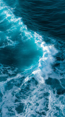 Fototapeta premium Aerial view of powerful ocean waves crashing with white foam. 