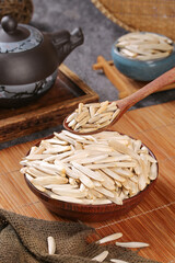 Aksu Xinjiang White Crescent Melon Seeds in Wooden Bowl Traditional Chinese Healthy Snack Ingredient