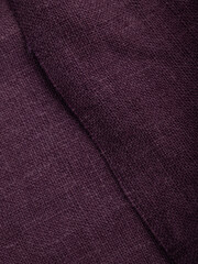 Dark dense fabric for sewing clothes, ironed, the texture of the fabric is visible