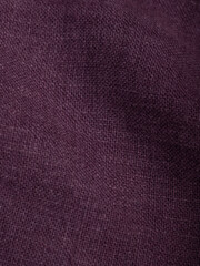 Dark dense fabric for sewing clothes, ironed, the texture of the fabric is visible