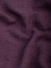 Dark dense fabric for sewing clothes, ironed, the texture of the fabric is visible