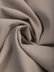 Light, dense fabric for sewing clothes, ironed, the texture of the fabric is visible
