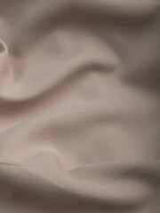 Light, dense fabric for sewing clothes, ironed, the texture of the fabric is visible