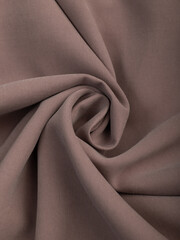 Light, dense fabric for sewing clothes, ironed, the texture of the fabric is visible