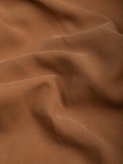 Dark dense fabric for sewing clothes, ironed, the texture of the fabric is visible