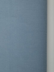 Light blue dense fabric, ironed, the texture of the fabric is visible