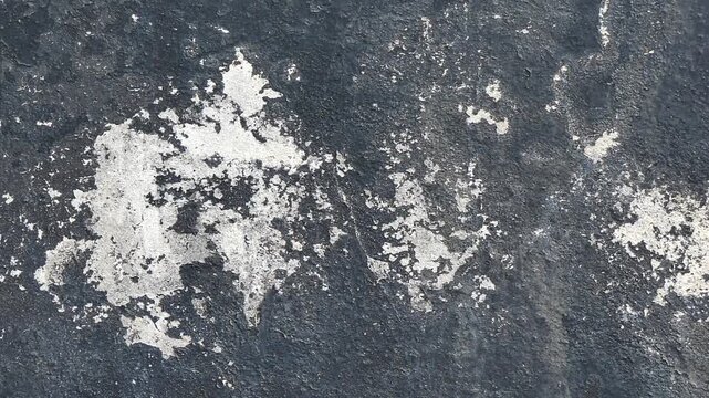 Old, peeling, dirty cement walls.
