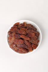Assortment of Dried Raisins in White Bowl - Healthy Natural Snack Food Ingredient