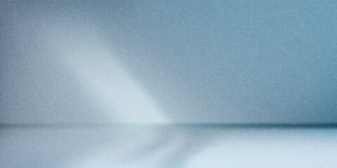 Minimalistic simple abstract light blue background for product presentation. Shadow and light from windows on wall grainy.