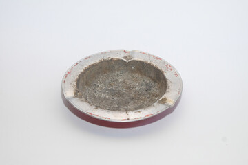 Close up grunge aluminum ashtray isolated on white background.Copy space for text.For graphic design and banners