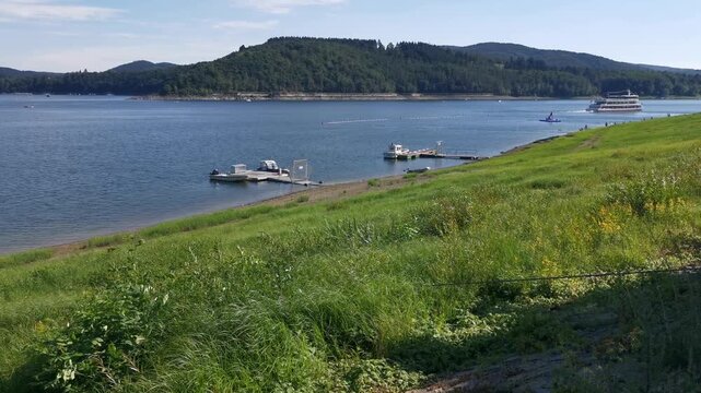 Edersee lake with passenger ferry and floating dock