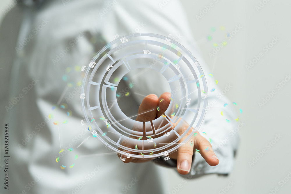 Poster a person uses their hand to interact with a transparent holographic circular data visualization.