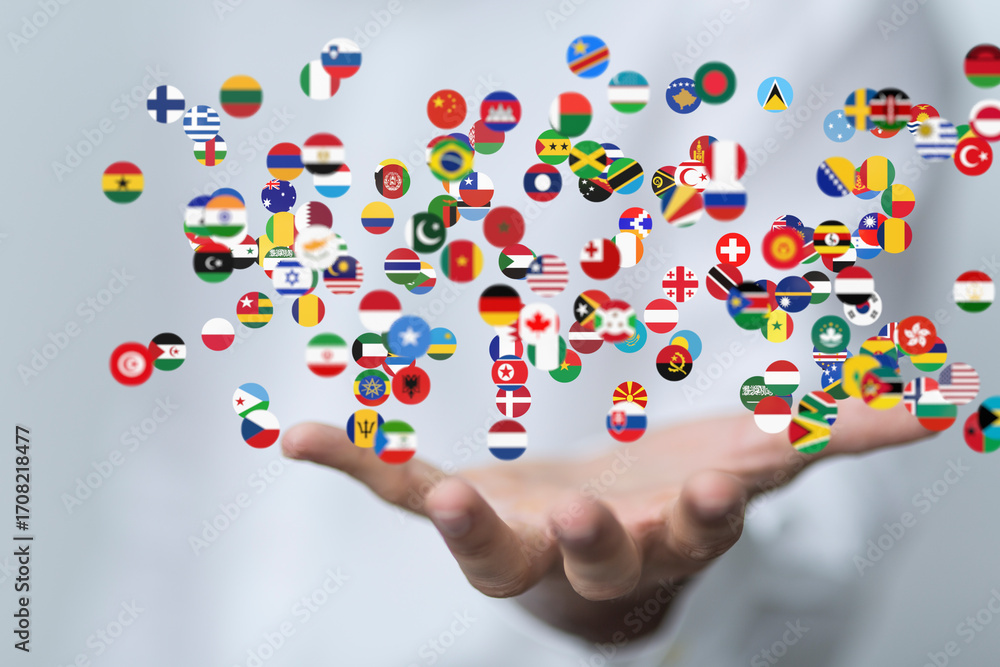 Poster image of many national flags floating above an open hand, symbolizing global unity and connection.