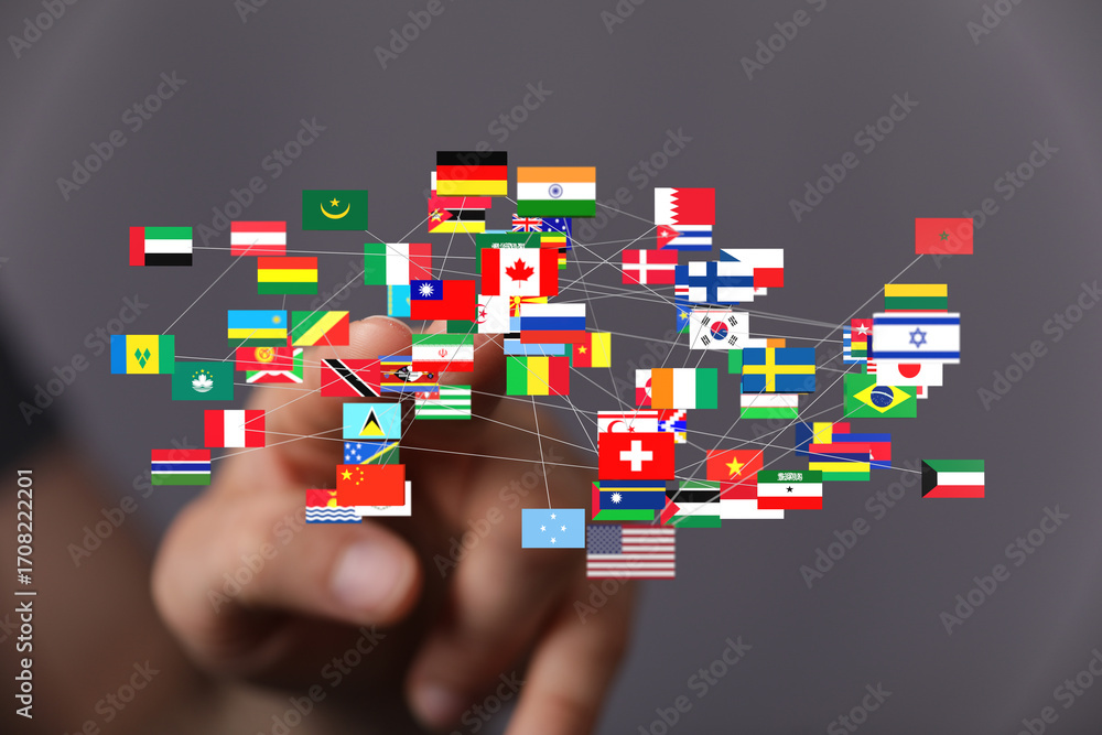 Poster hand interacting with a digital network of world flags, representing global connection and internati