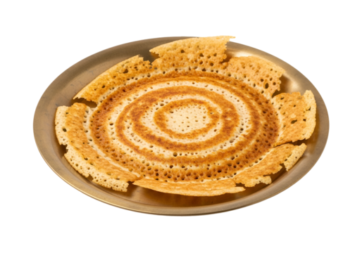 A circular, golden-brown flatbread, intricately patterned with concentric circles, sits attractively on a metallic plate against a black background.